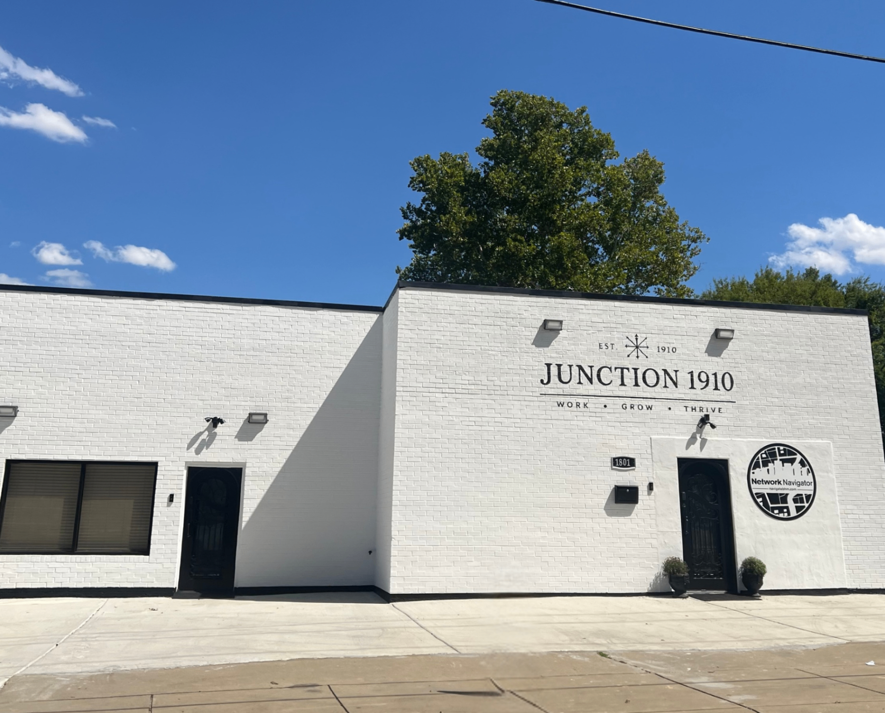 The Junction 1910 building at 1801 in Ensley, Birmingham, with the Network Navigator sign by the entrance