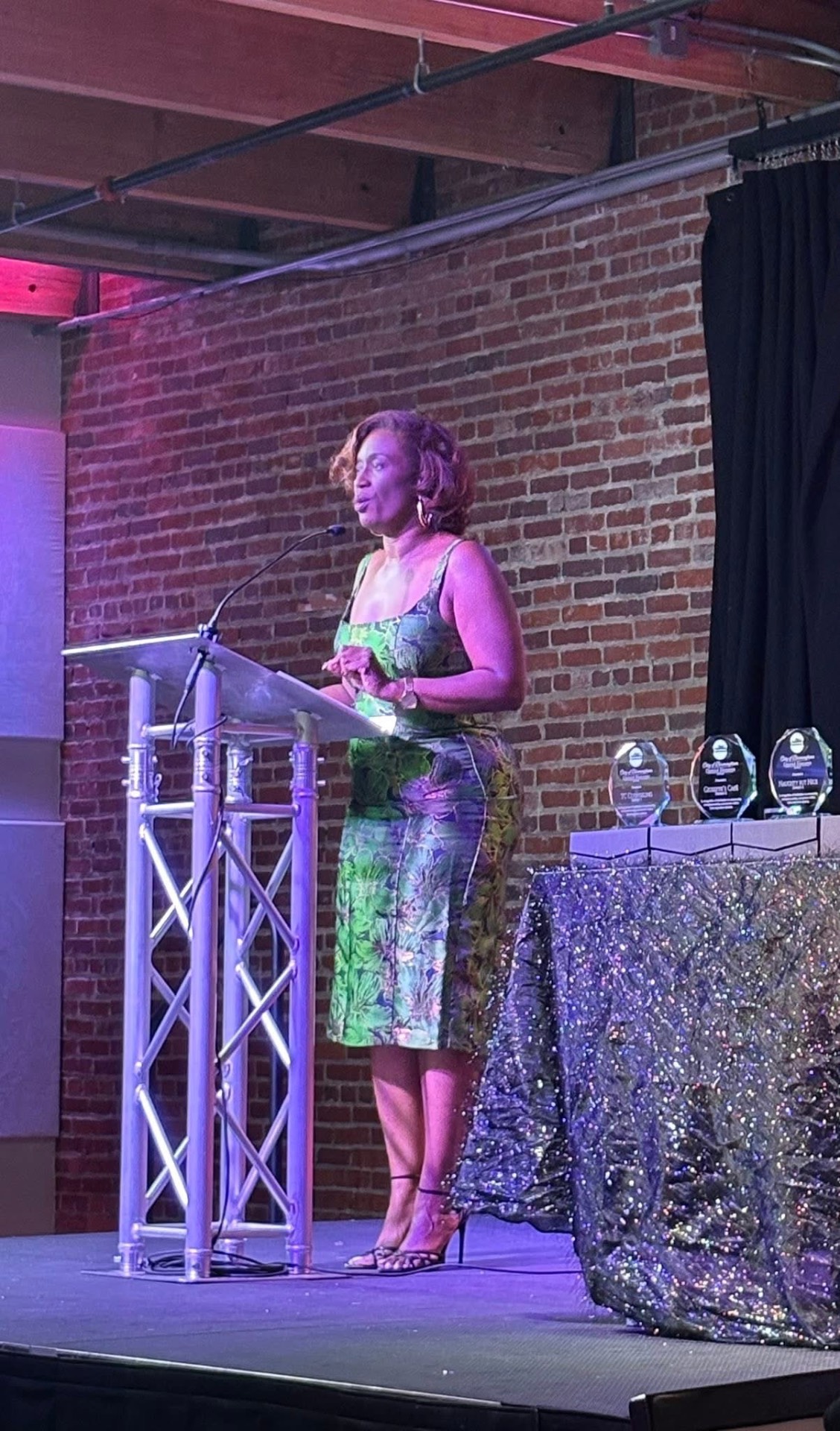 Naila Jackson speaking at the podium during the Small Business Awards